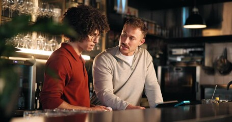 Bartender, men and tablet at pub for POS system, stock inspection and inventory checklist at small business. People, bar manager and digital tech with app for menu, teamwork and explain training