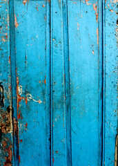 The old blue door is an antique from the past.