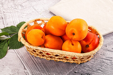 Raw ripe sweet apricots heap