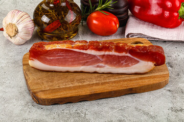 Piece prosciutto crudo over board