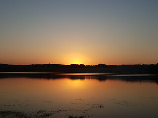 sunset over the lake in summer