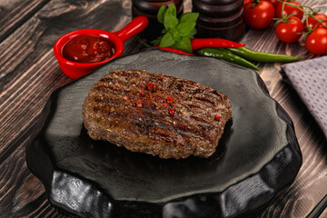 Grilled beef burger cutlet with sauce