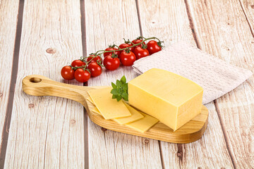 Yellow cheese piece with slices