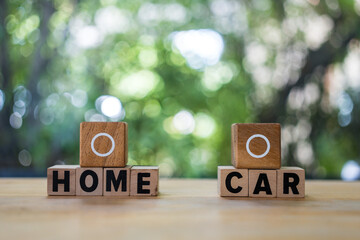 A wood block with empty circle for select a home model or a car model. A loan for asset or saving...