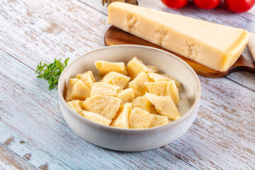 Parmesan cheese pieces in the bowl