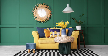 Interior of stylish living room with yellow sofa, poufs and mirror