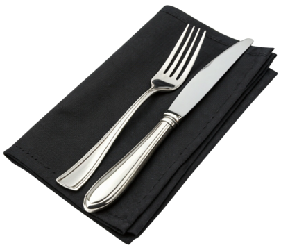 fork and knife on black napkin on white background