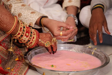 image shows a traditional Indian wedding ritual known as 