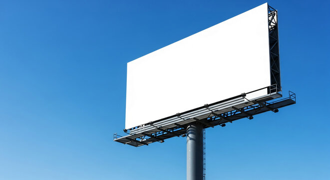 Large blank billboard against a clear blue sky, showcasing ample free space for advertisement or text, ideal for outdoor advertising mockups and promotional campaigns