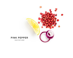 Pink peppercorns heap with lemon wedge and red onion slices photography isolated on white background