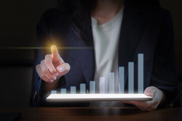 Close-Up Image of a Businesswoman's Hand Using a Digital Tablet.