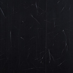 Abstract textured background with fine white scratches on black
