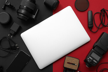 Composition with different gadgets and modern laptop on dark background