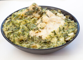 Traditional South African side dish of spinach and pap or maize meal