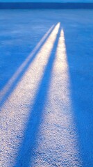 Diagonal Light Beams on a Blue Textured Surface