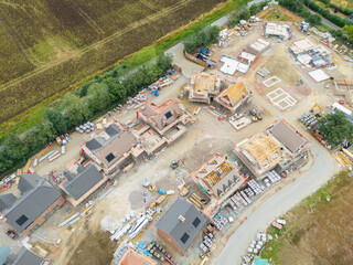 High up view of a partially completed housing development site on once brownfield land. Nearly...