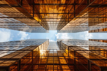 Low angle view of two golden skyscrapers leading to the sky, Hong Kong