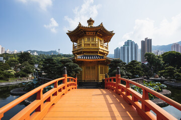 Wooden bridge leading to traditional pavilion, Hong Kong, China