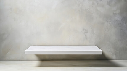 Minimalistic white floating shelf with soft shadows on textured wall background