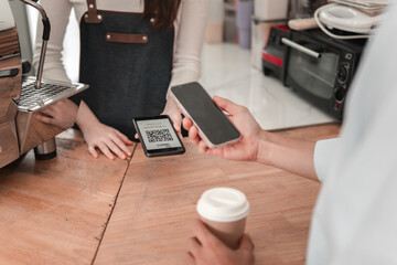 Customer completes mobile payment in urban setting, close-up on modern transaction technology