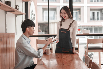 Urban book discussion between young man and woman in modern  setting, lifestyle photography