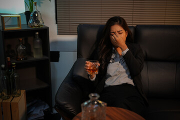 Closeup business woman holding a glass of whiskey