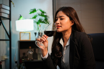 Closeup business woman holding a glass of wine