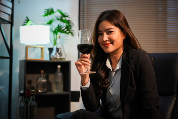Closeup business woman holding a glass of wine