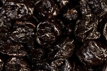 a large amount of prunes used in cooking, black prunes from small plums are dehydrated and pitted