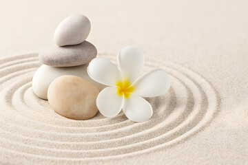 Zen Garden with Stacked Stones and Plumeria Flower in Sand for Peaceful Meditation and Balance
