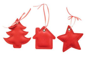 Christmas tree decorations made of leather, handicrafts. Leather Christmas tree decorations in red, featuring star, house, and tree shapes with ribbons