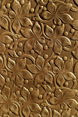 Genuine leather texture with embossed pattern showcasing intricate details and rich color, perfect for design and artistic applications. flowers, natural pattern