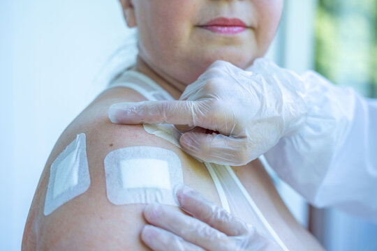 Doctor, Nurse treating surgical wound, shoulder injury, sterile tools, healing process, clinical hygiene, post-surgery care