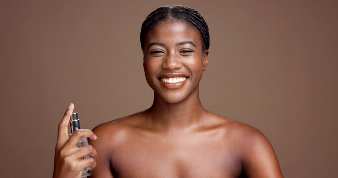 Happy, woman and spray for smell, face and fresh scent with fragrance, studio background or perfume. Mockup space, self care and black person with cosmetics for bodycare, confident and grooming