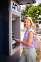 Summer moments at the ATM in Greece by the coast