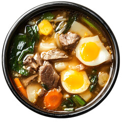 A bowl of hearty soup with meat vegetables and soft boiled eggs inside