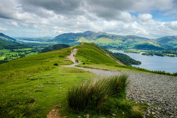 Hiking trail on Catbells looks back along the descending ridgeline, with Derwentwater shimmering...