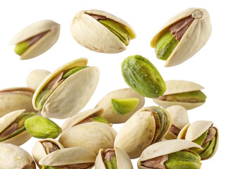 A pile of fresh pistachios with green kernels falling isolated on transparent background