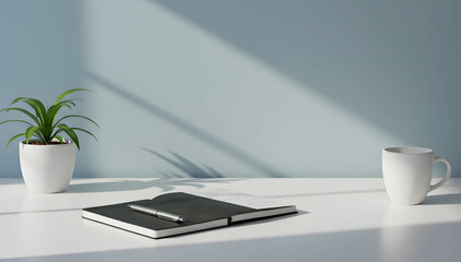 White desk with plant and coffee cup under sunlight
