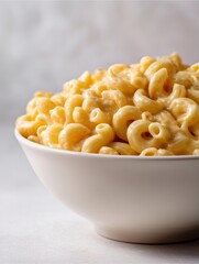 Delicious Mac and Cheese Delight: A close-up shot showcases a generous serving of creamy, golden mac and cheese in a pristine bowl, tempting the viewer with its savory goodness. 