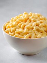Creamy Mac and Cheese: A close-up shot of a bowl of creamy macaroni and cheese, showcasing its rich, cheesy texture and appetizing golden color.