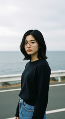 Serene Coastal Portrait Young Woman with Short Black Hair