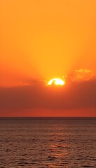 Vibrant Sunset Over the Ocean Horizon with Golden Reflection