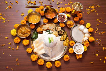Grand Traditional Bengali Thali Served on Brass Plate for Aiburobhaat or Jamai Shashti with Rice,...