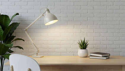 Simple wooden desk with indoor plant and desk lamp