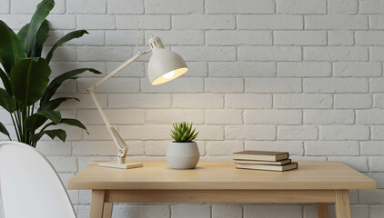 Simple wooden desk with indoor plant and desk lamp