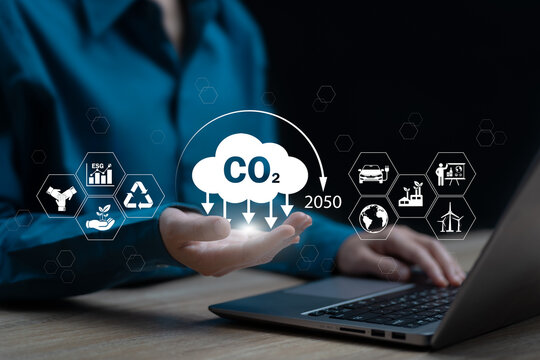 2050 Carbon-neutral Net-zero greenhouse gas emissions target concept, Businesswomen show carbon reduction target, Environmental conservation campaign, Climate neutral long term, EGS, Renewable energy