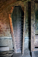 Wooden iron maiden medieval torture device like coffin cabinet with a hinged front and lined with...