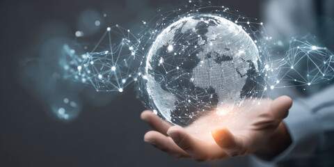 Businessman holds a digital Earth hologram, symbolizing global connectivity and advanced technology
