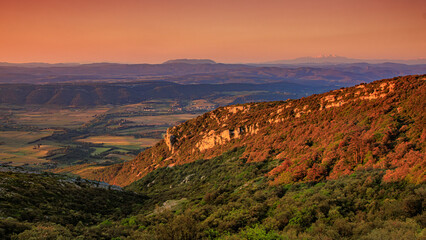 Early morning landscape from the top of Mount Alaric in the South of France. Garrigue, rocks,...